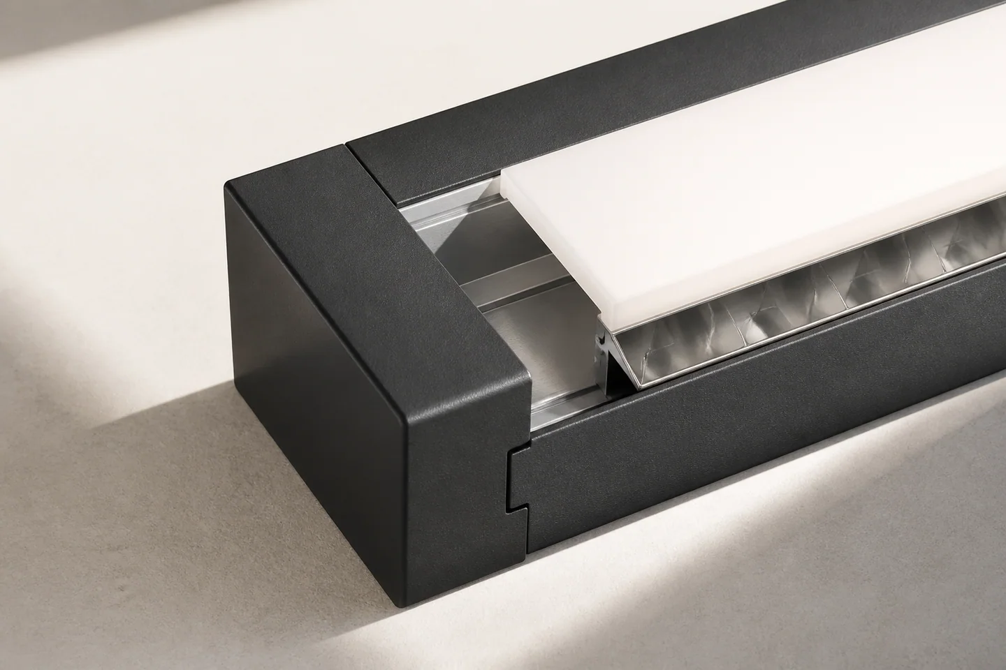 Close-up of a graphite aluminium luminaire profile, optical reflector and diffuser