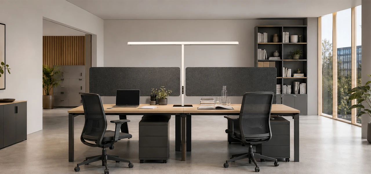 White office luminaire illuminating two shared workstations